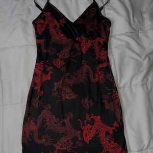 Black mini dress with red dragons